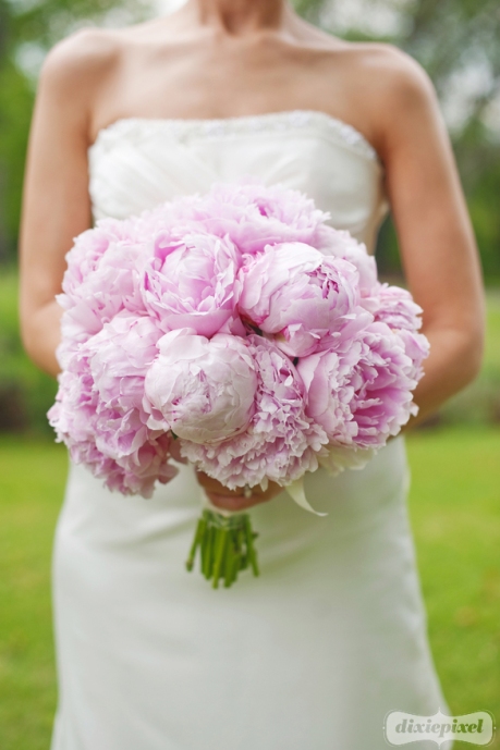 The boutonnieres featured spray garden roses and Dusty Miller The bridal 